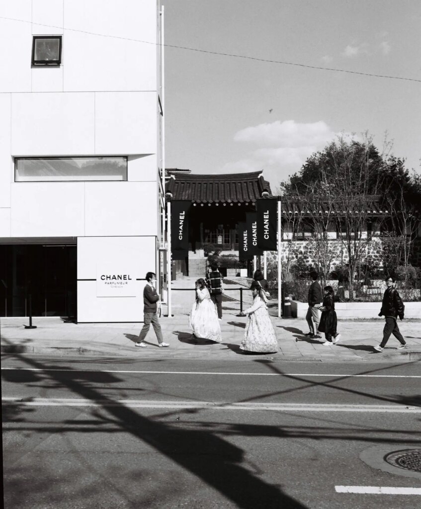 In the midst of the historic village of Bukchon sits a Chanel store, whose sidewalk is constantly busy with sight-seers coming and going from the nearby palace.