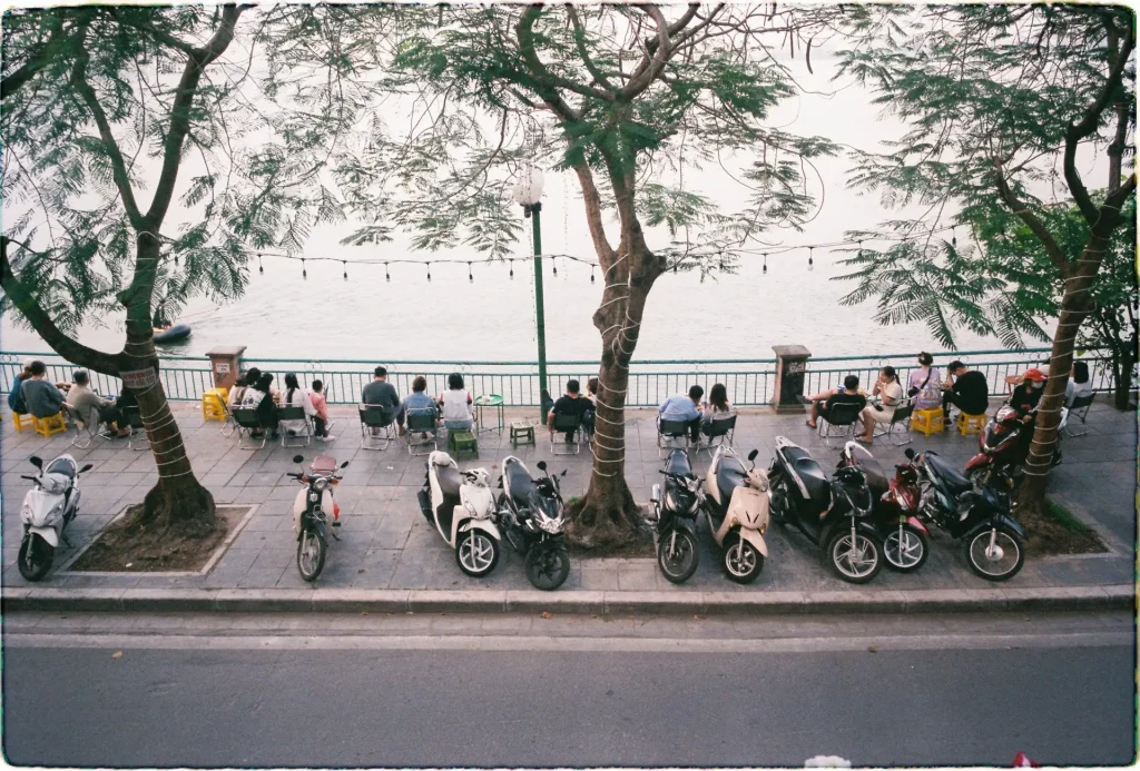 People sitting at a lake in 