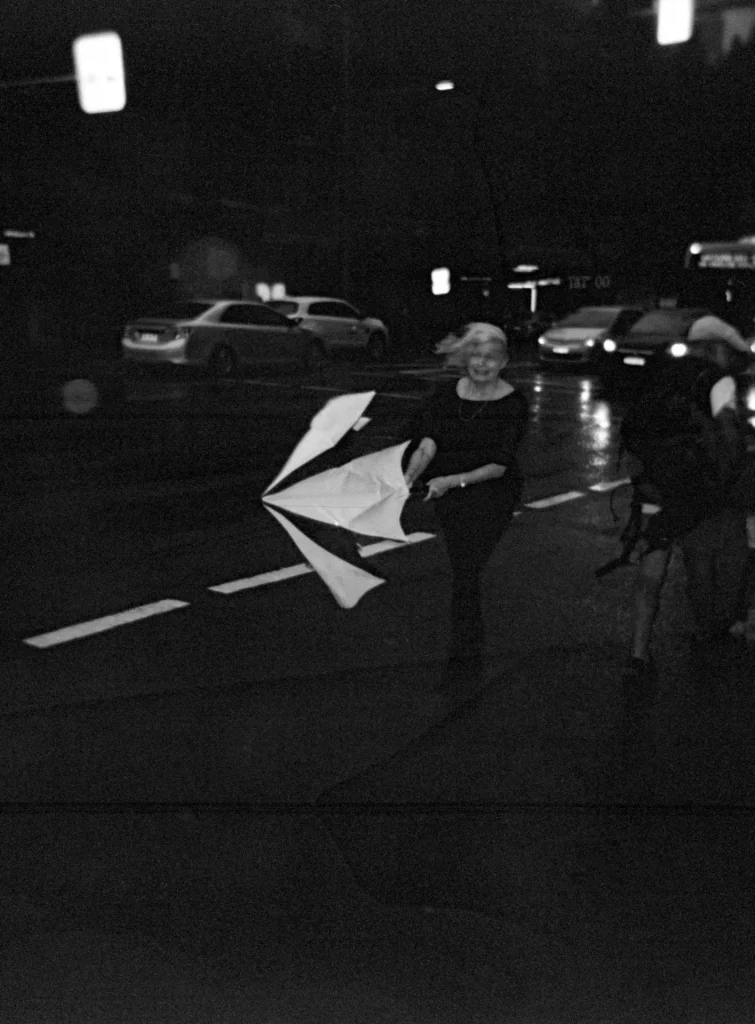 Woman with umbrella and wind