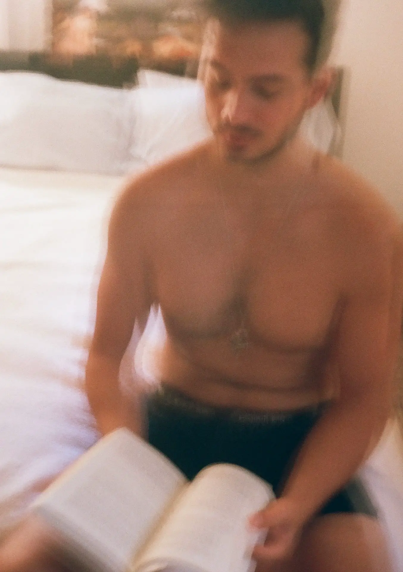 Male reading a novel thoughtfully