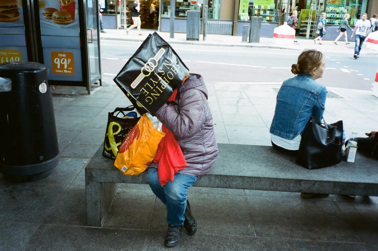 Person with shopping bag on head