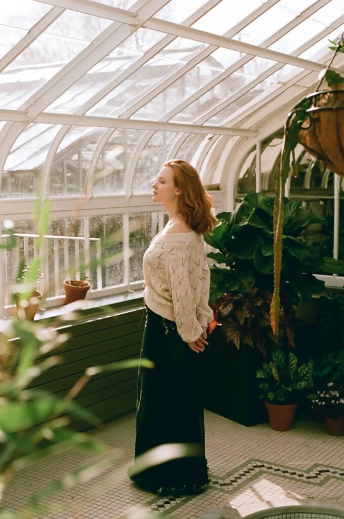 woman in a greenhouse taken on luminar 100