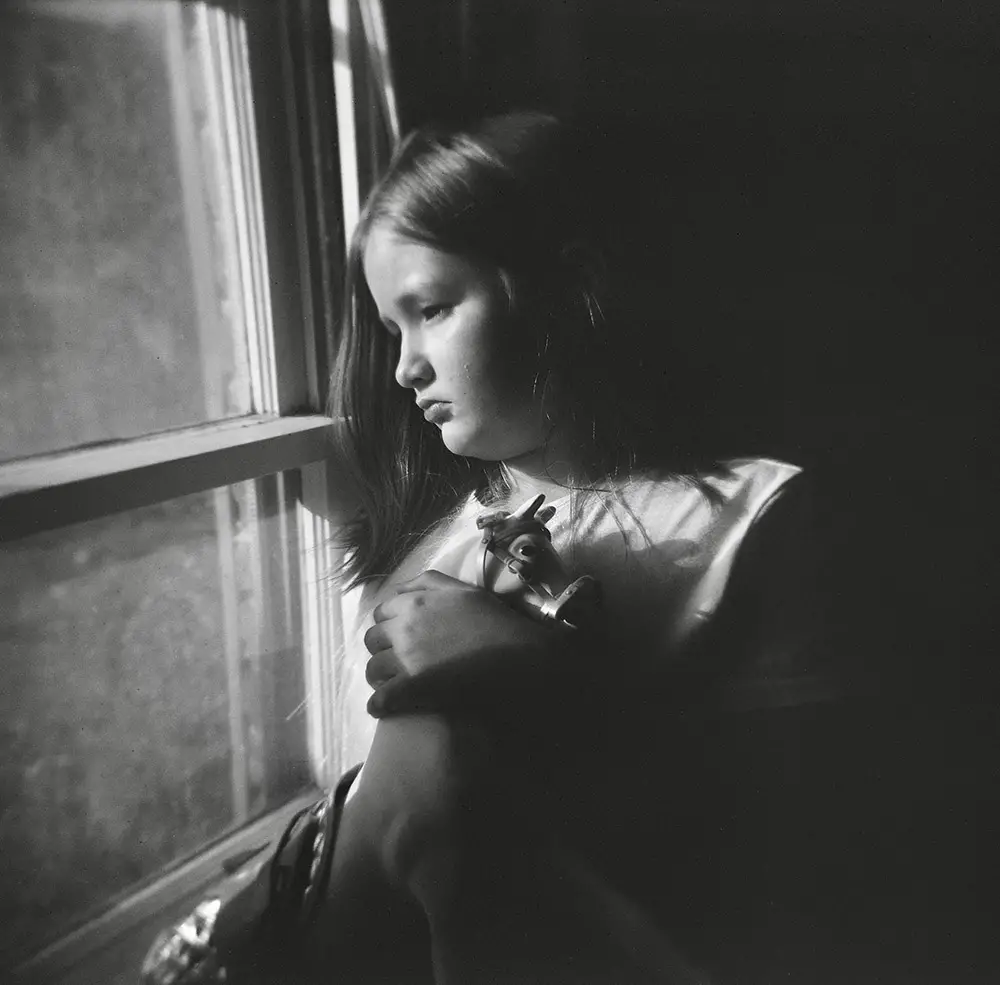 girl looking out window