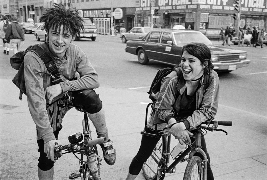 two messengers with bikes on corner