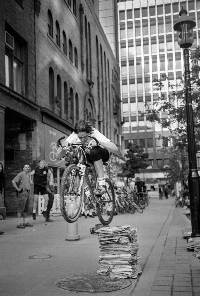 messenger on bike leaping