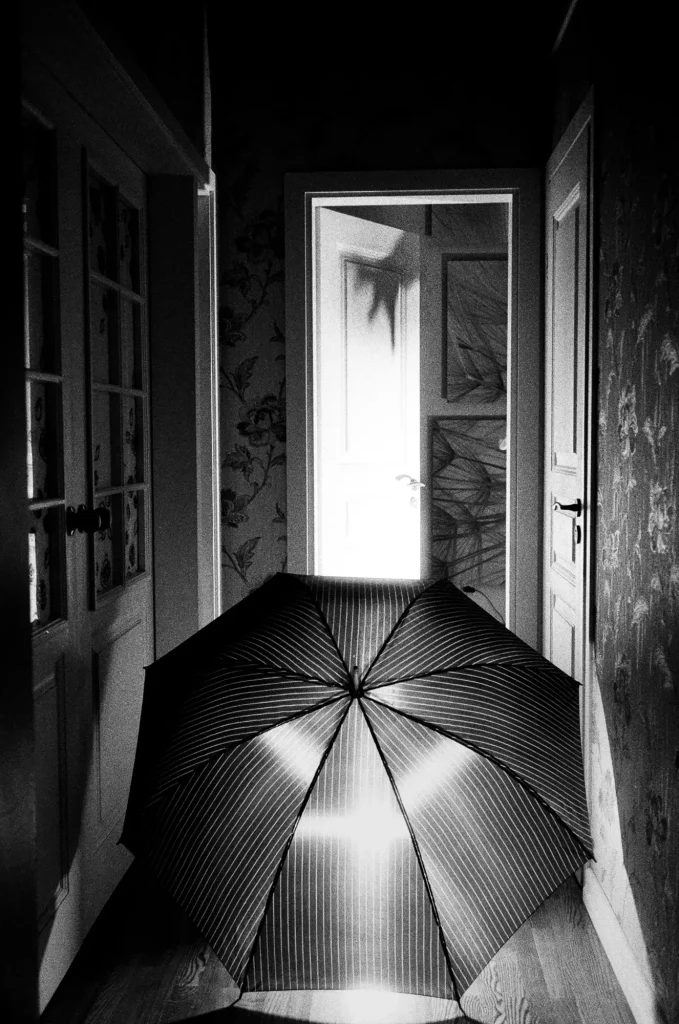 open door and umbrella at night