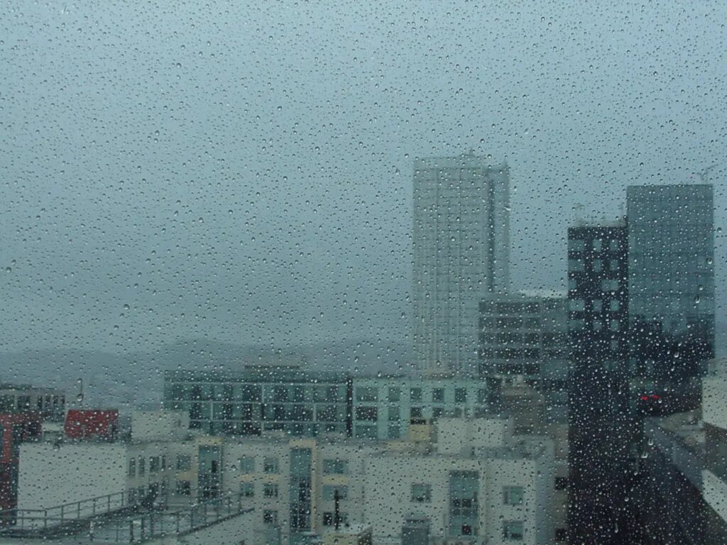 Cityscape through a rain soaked window
