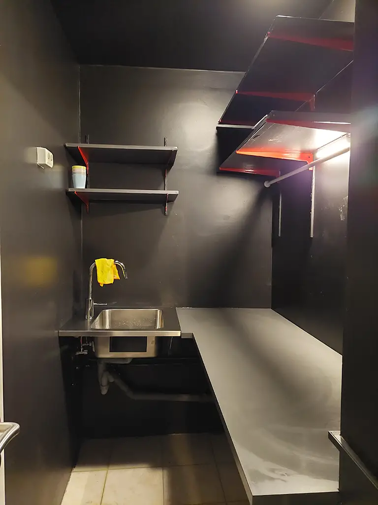 darkroom, counter top, black room, shelves, brackets, sink, pipes