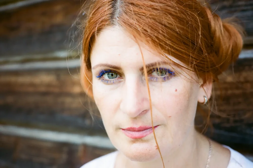 portrait of woman with red harir