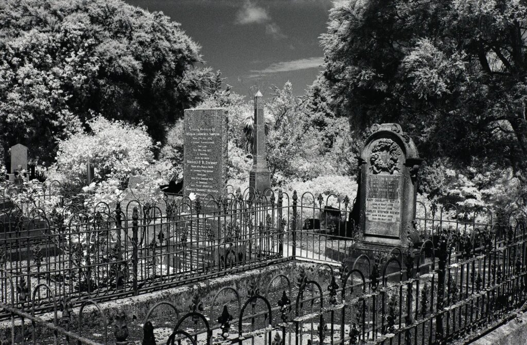 Headstones and wrought iron, Northern Cemetery, Dunedin.