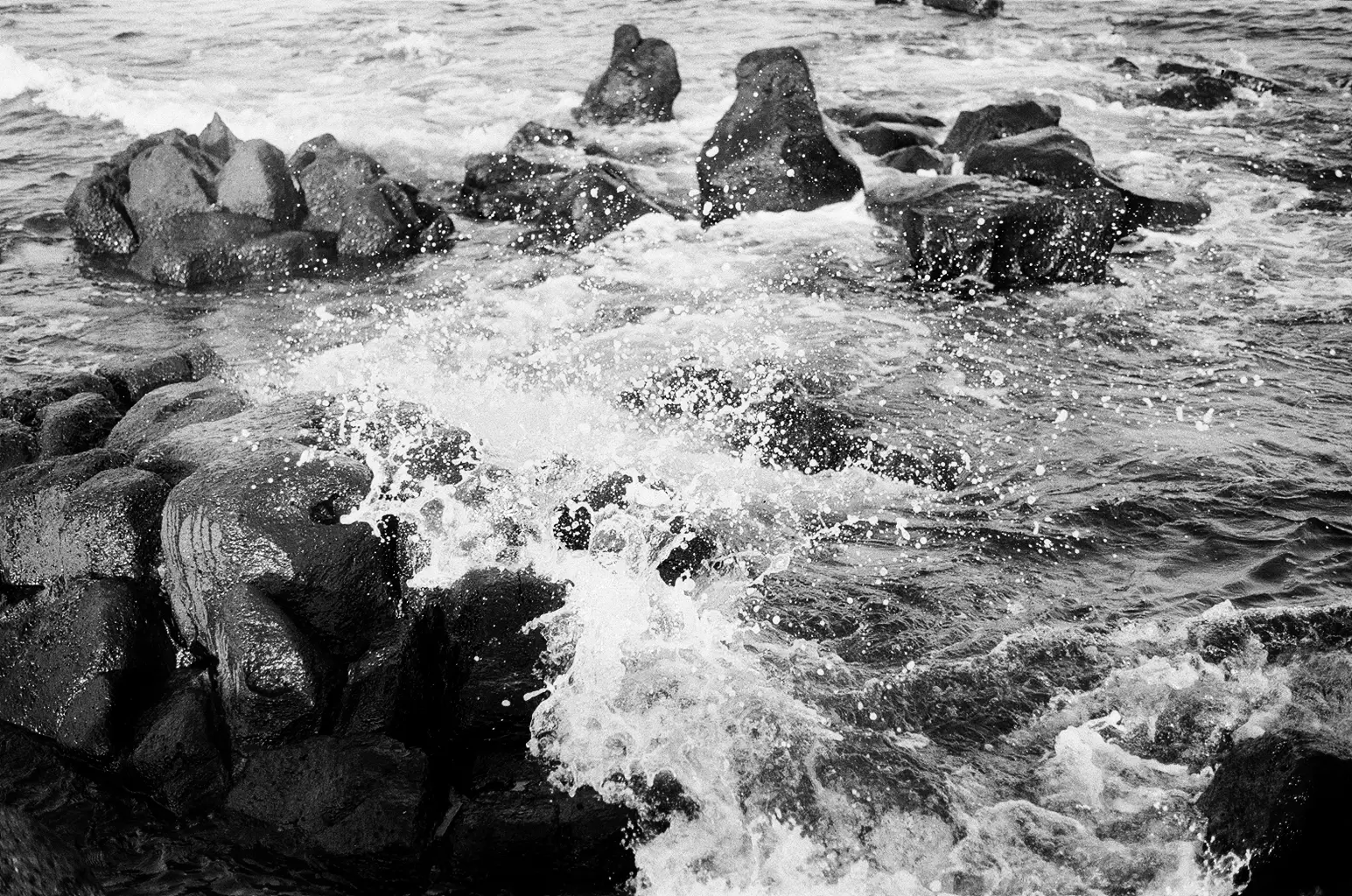 Wave crashes on rocks