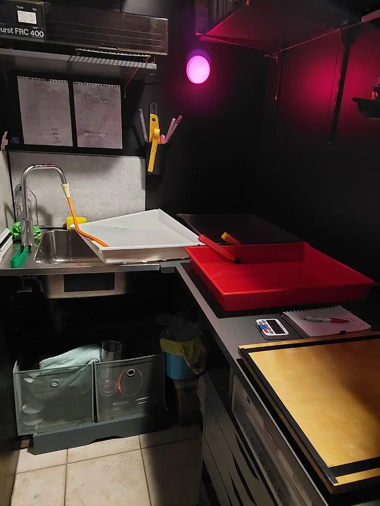 trays, developing, darkroom, wonky, leaking, enlarger, red light, sink, tap, towel