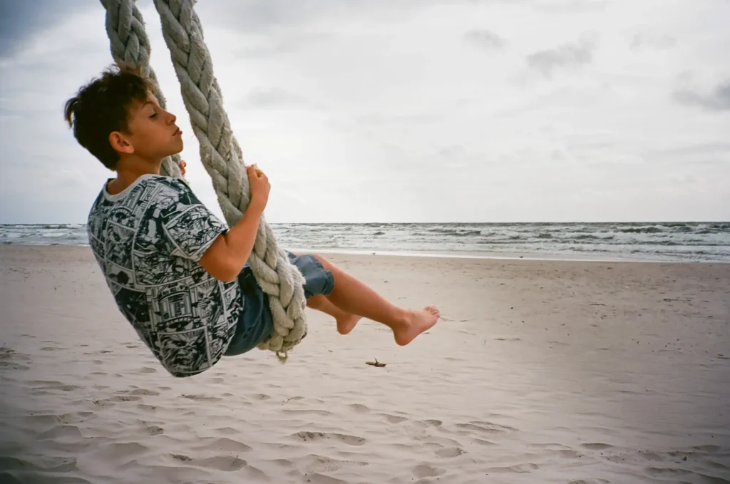 boy in rope swing on beach Contax T2 Kodak Ektar 100