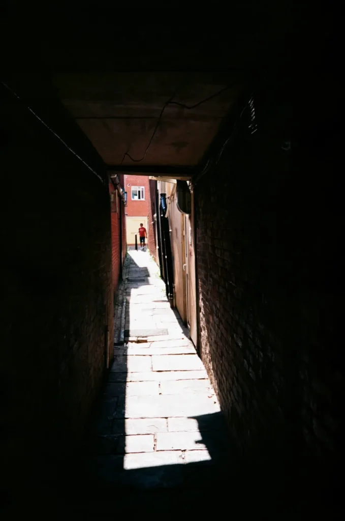 Man in alley street photo