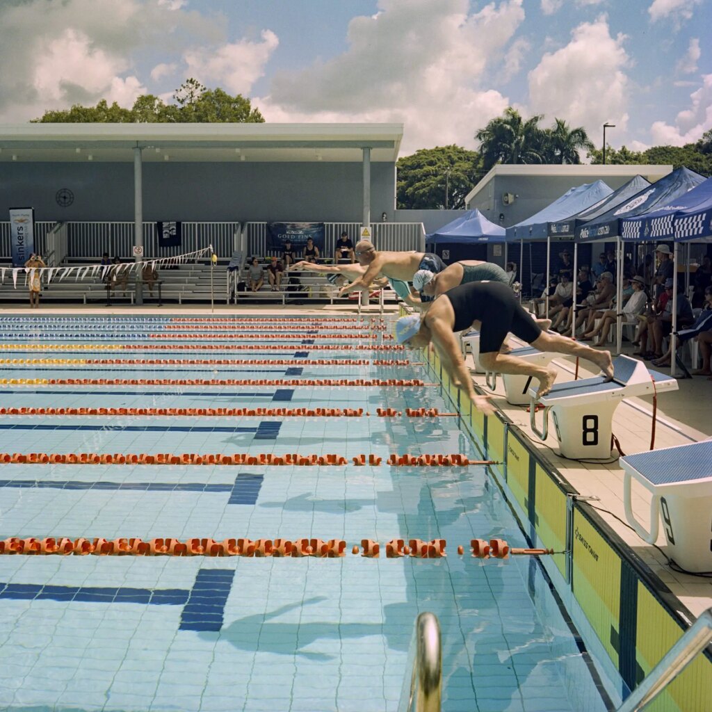 2 The start of a race at the Queensland Masters Swimming championships in Mackay, March 2023. Portra 400, F11, 1/500. I like that you can see both the shadows and the reflections of the divers in this shot.