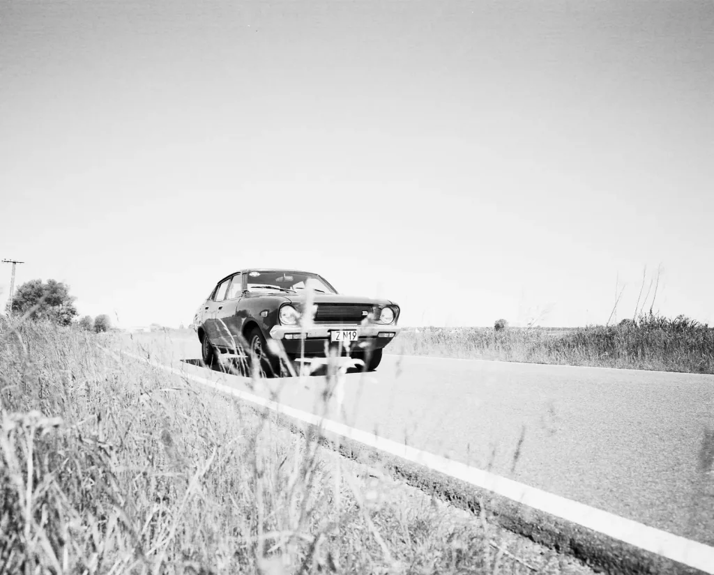 Datsun 120Y shot on Rollei RPX25 with Mamiya 7ii