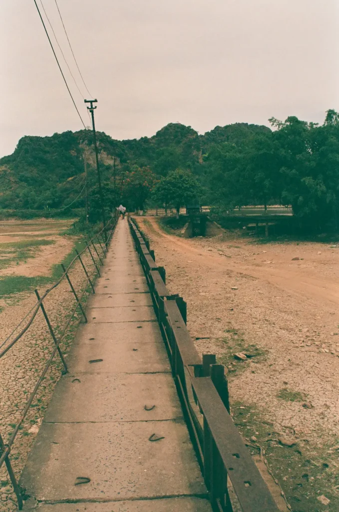 a concrete bridge from the bank to the island