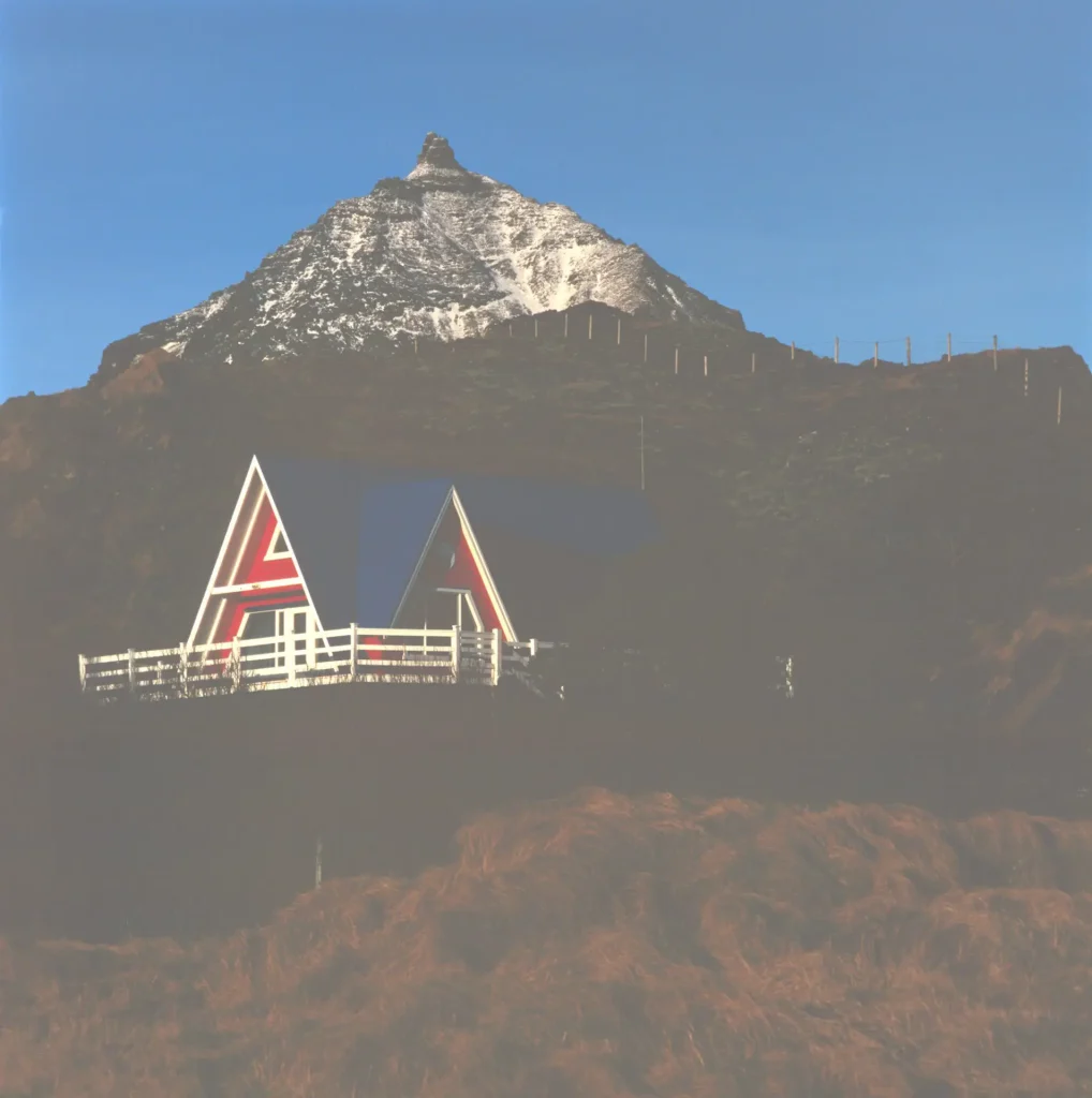 Blue house and mountain