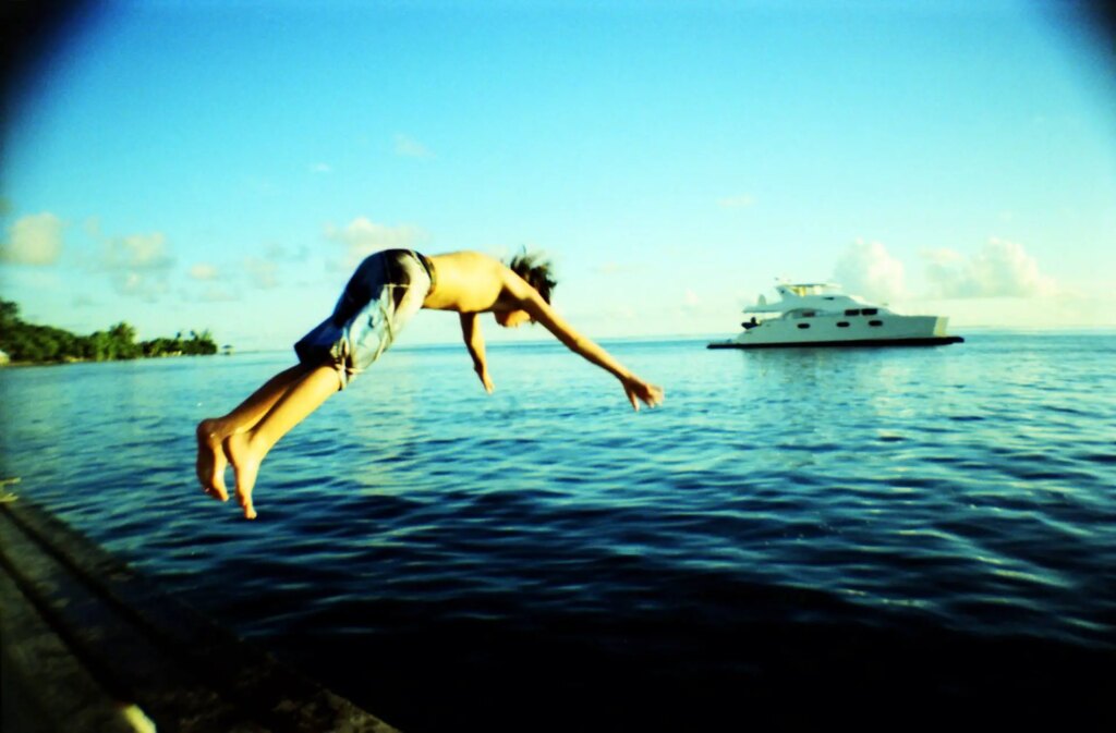 person diving into the ocean