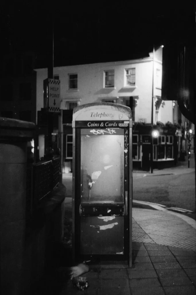 A vandalised phone booth.
