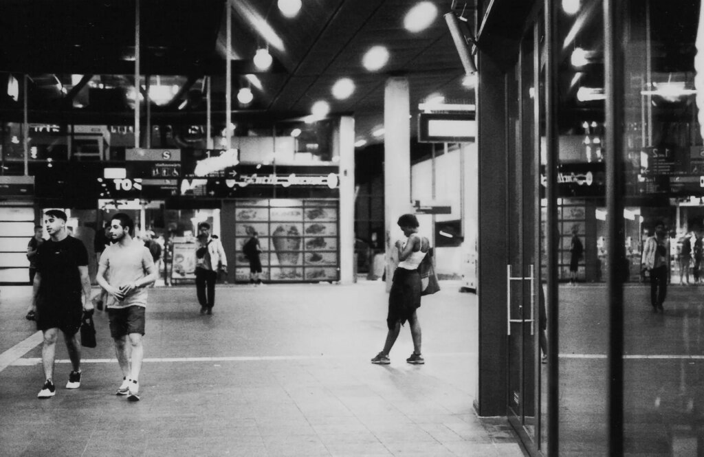 Mirrored Life at a Train Station