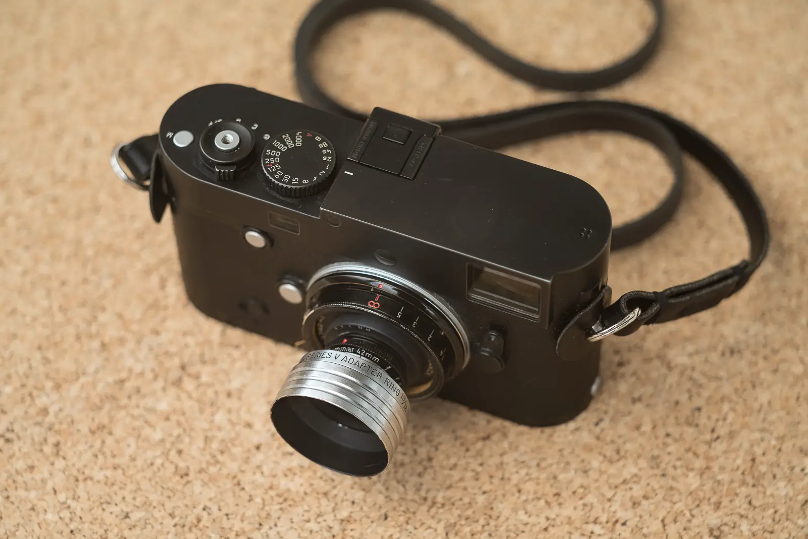 Kodak Series V slip-on adapter and matching hood mounted on the Summar 42mm