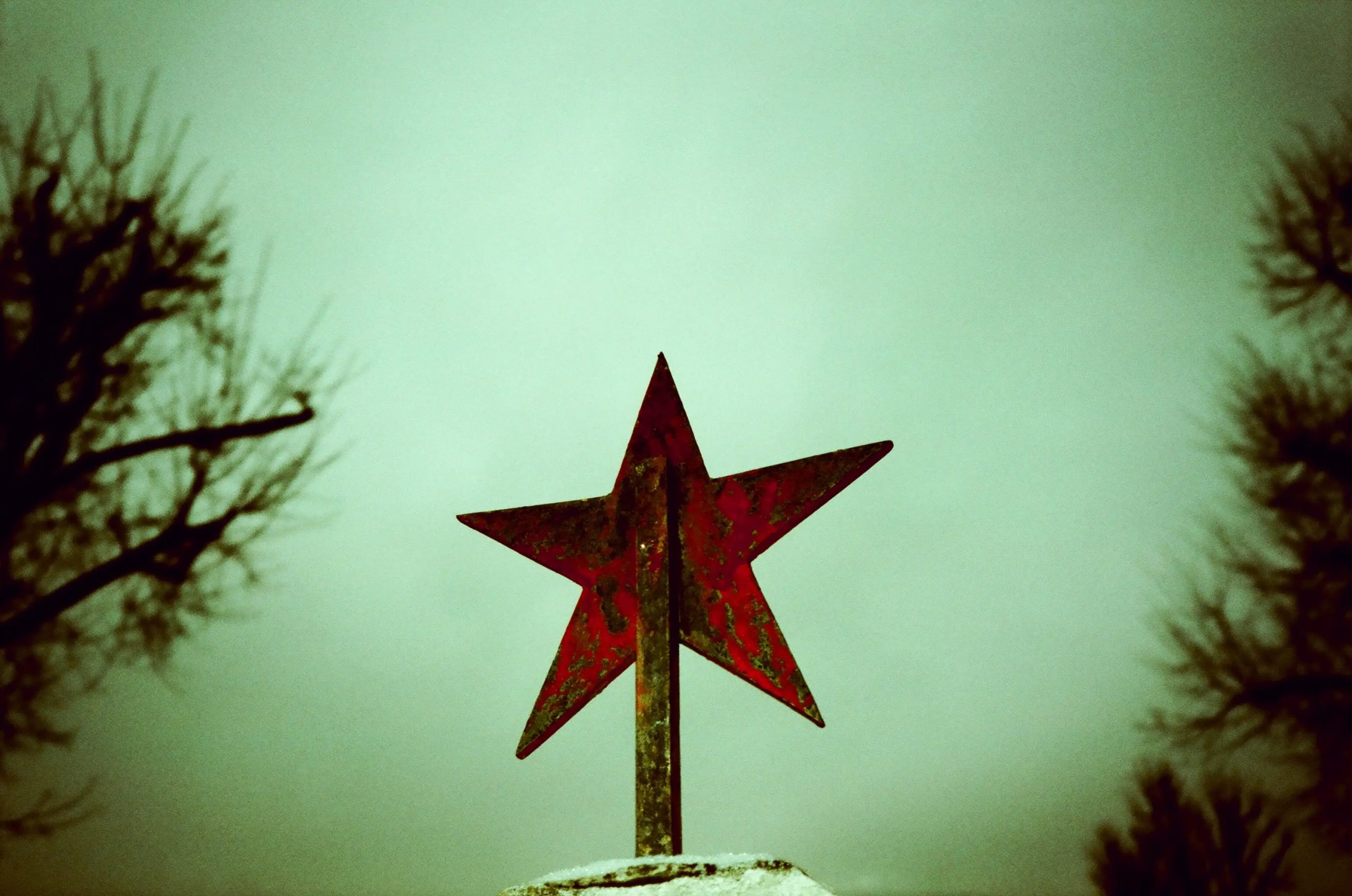 A red star sits on top of the grave of a Soviet soldier. Malacky, Slovakia, 2014