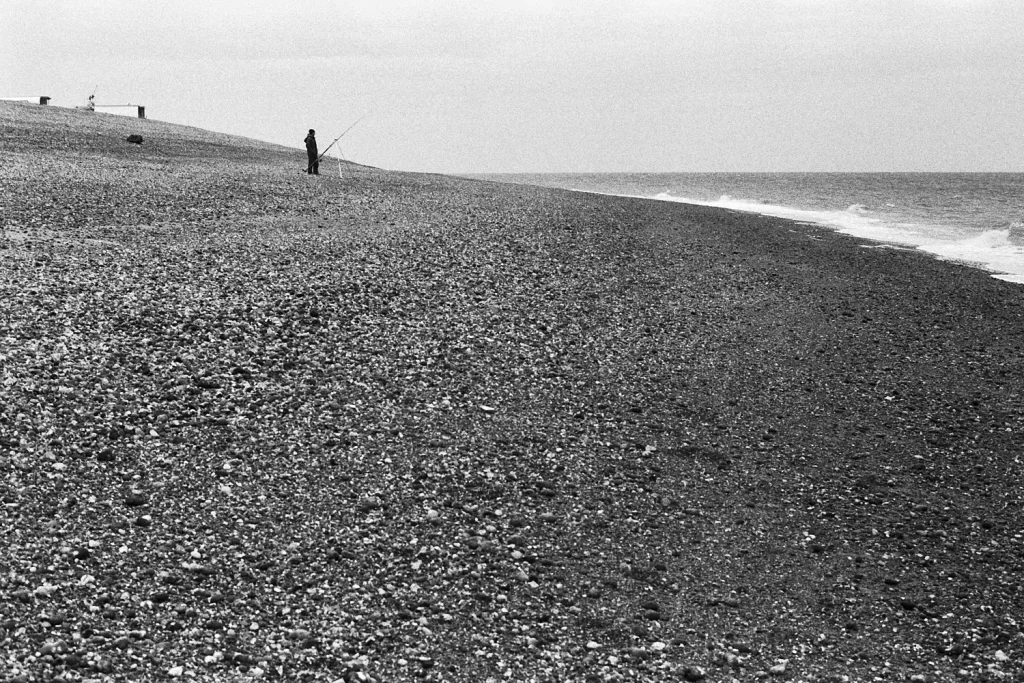 A fisherman on the beach, Dungeness, Kent.