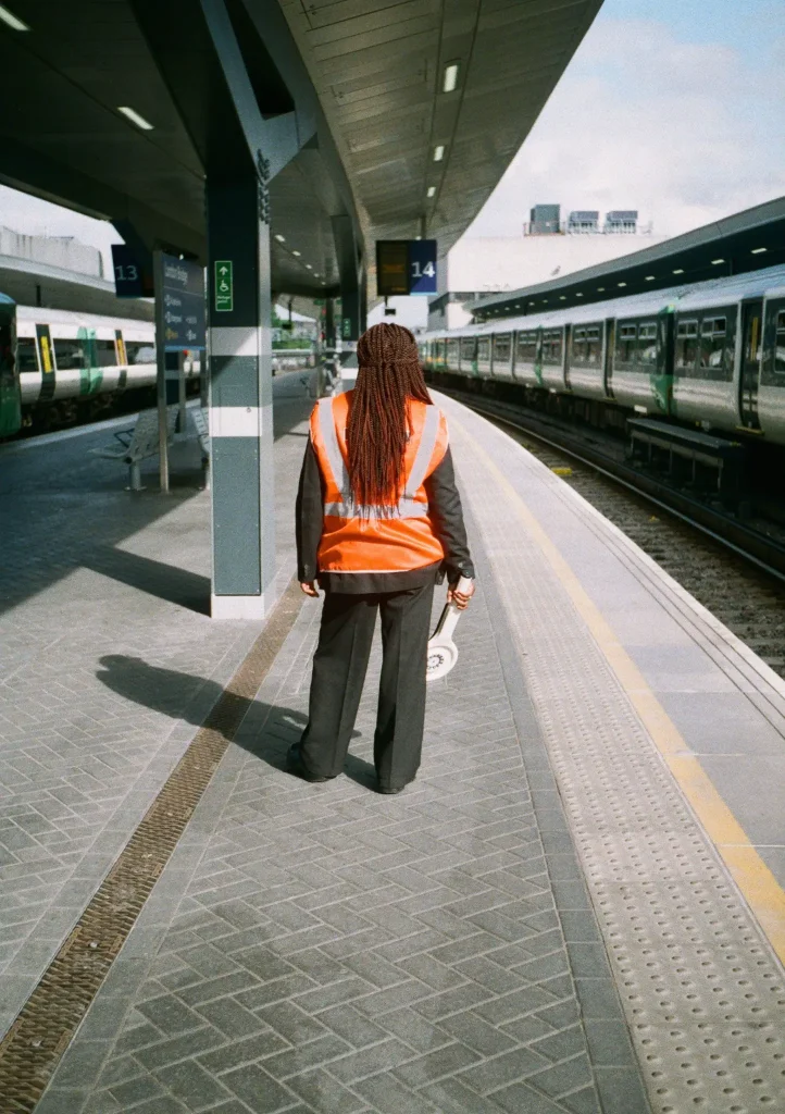 Photo of woman at train station with Olympus Pen EE2