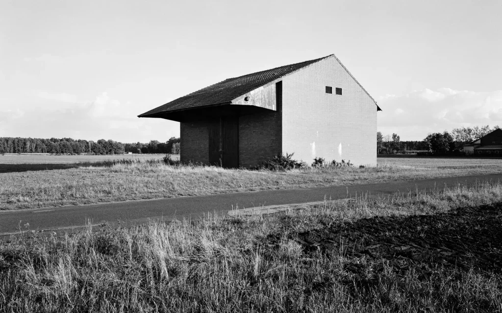 agricultural landscape with a brick shed 