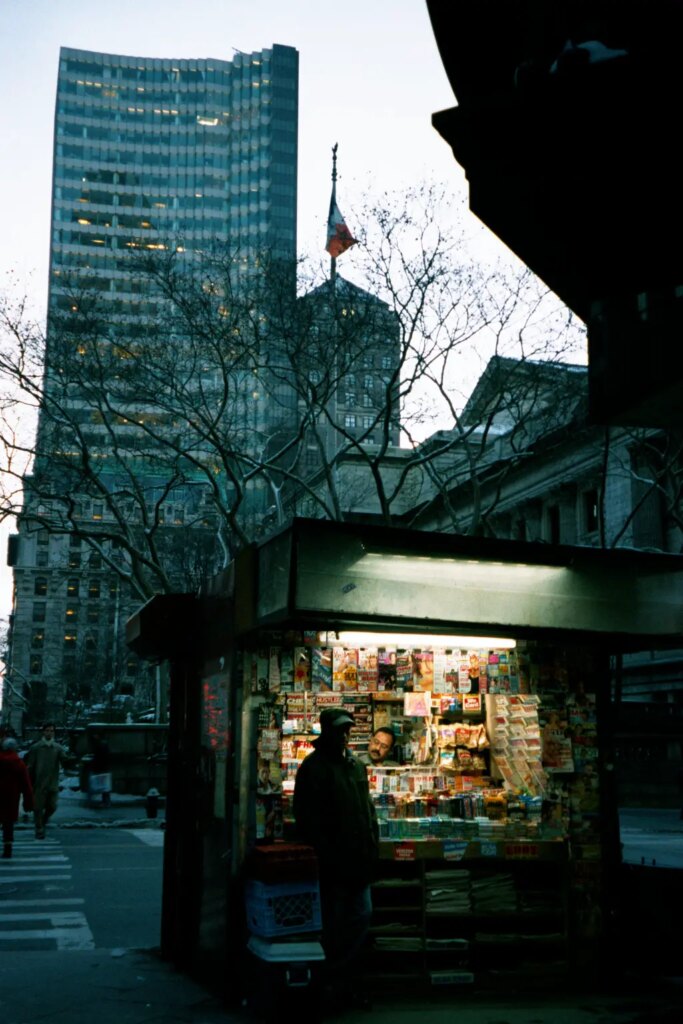 Newspaper kiosk at dusk