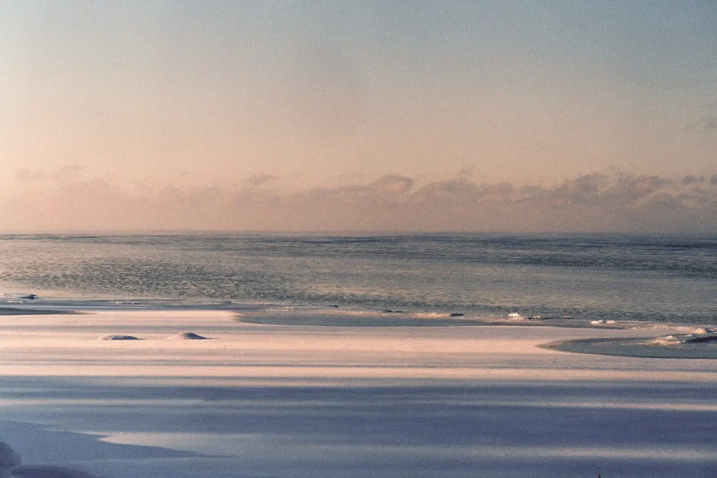 Photo of a beach in snow taken on slide film.