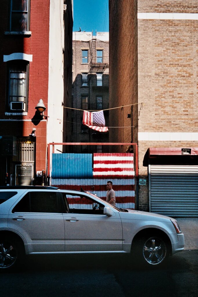 man walks along the street in NYC