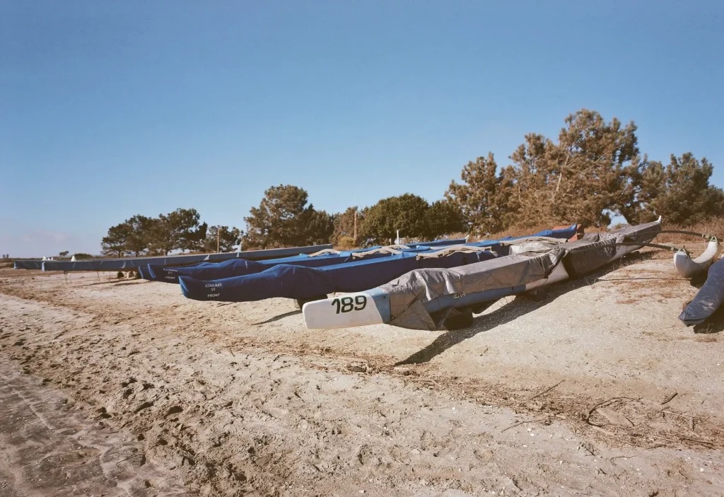 Canoes stored on the beach sand.