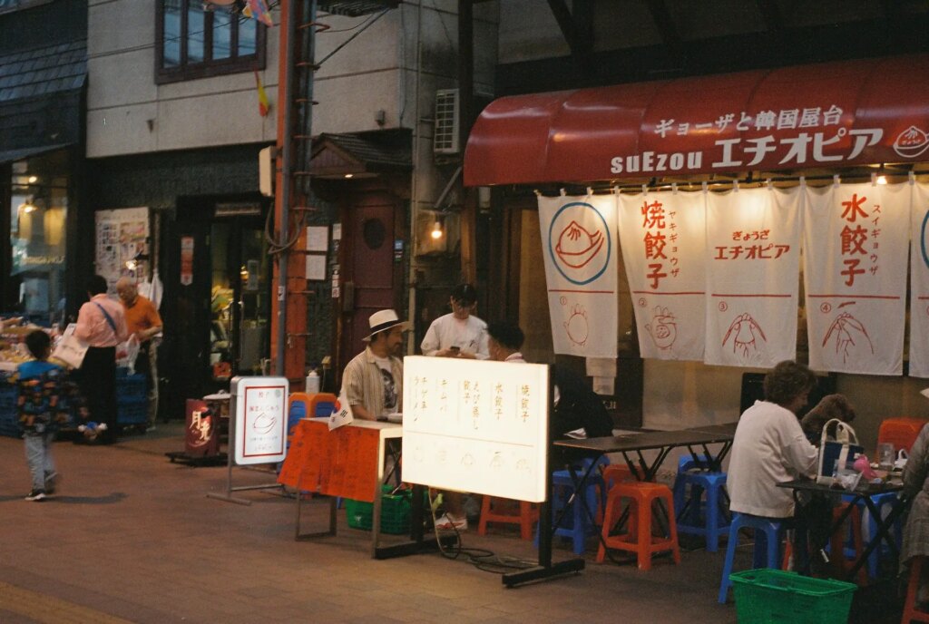 Small restaurants with tables in the covered walkway