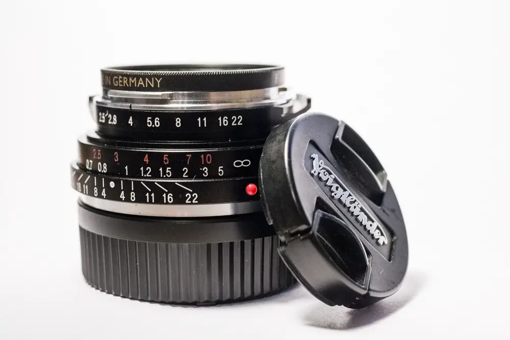 Lens and cap