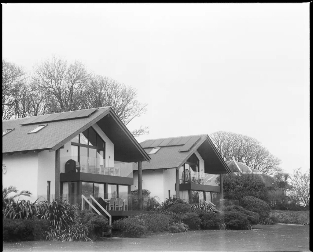 Two houses with a large front yard 