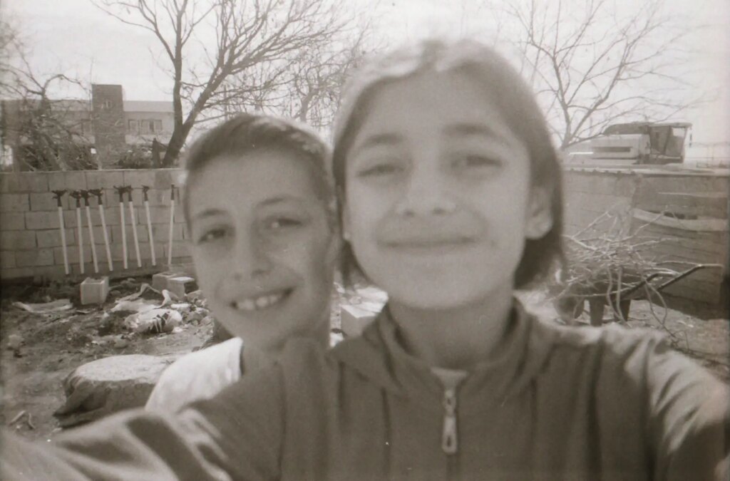 selfie on film of two children outdoors in the village