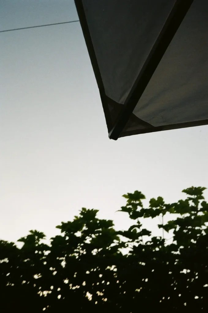 Corner of Parasol against Sky at Dusk