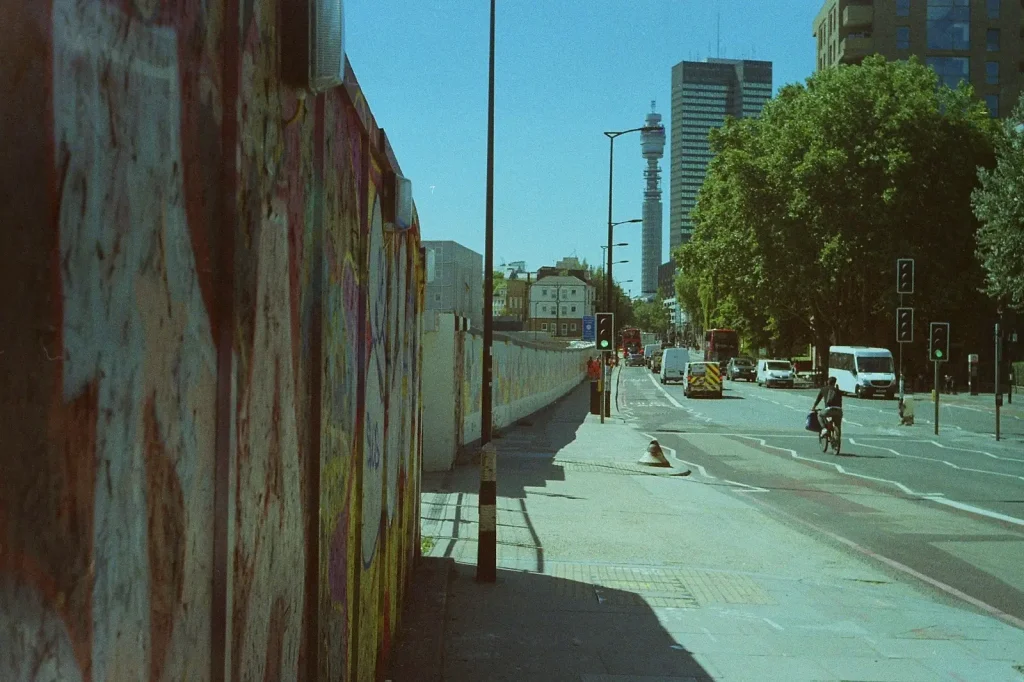 photo of london road with graffiti, bt tower and euston tower