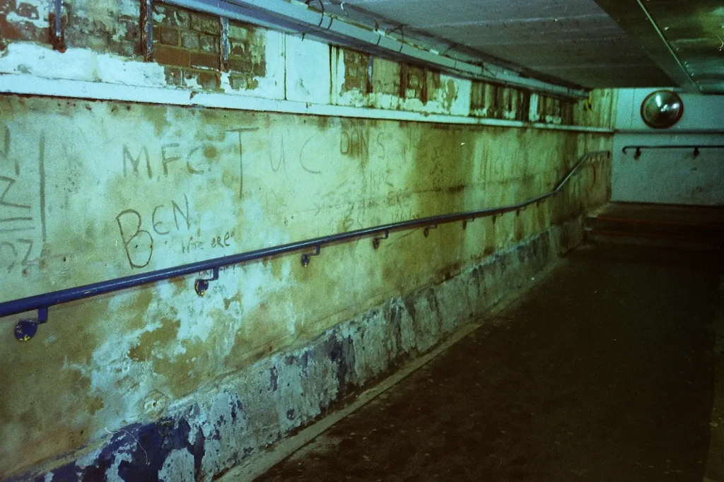 photo of graffiti in dried cement wall