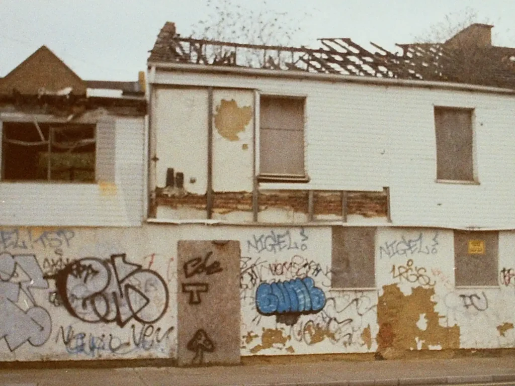 shell of house with graffiti