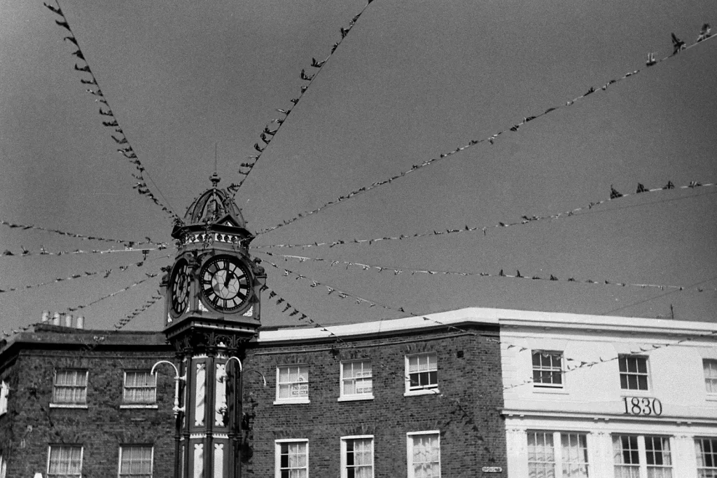 b/w photo of clocktower with bunting