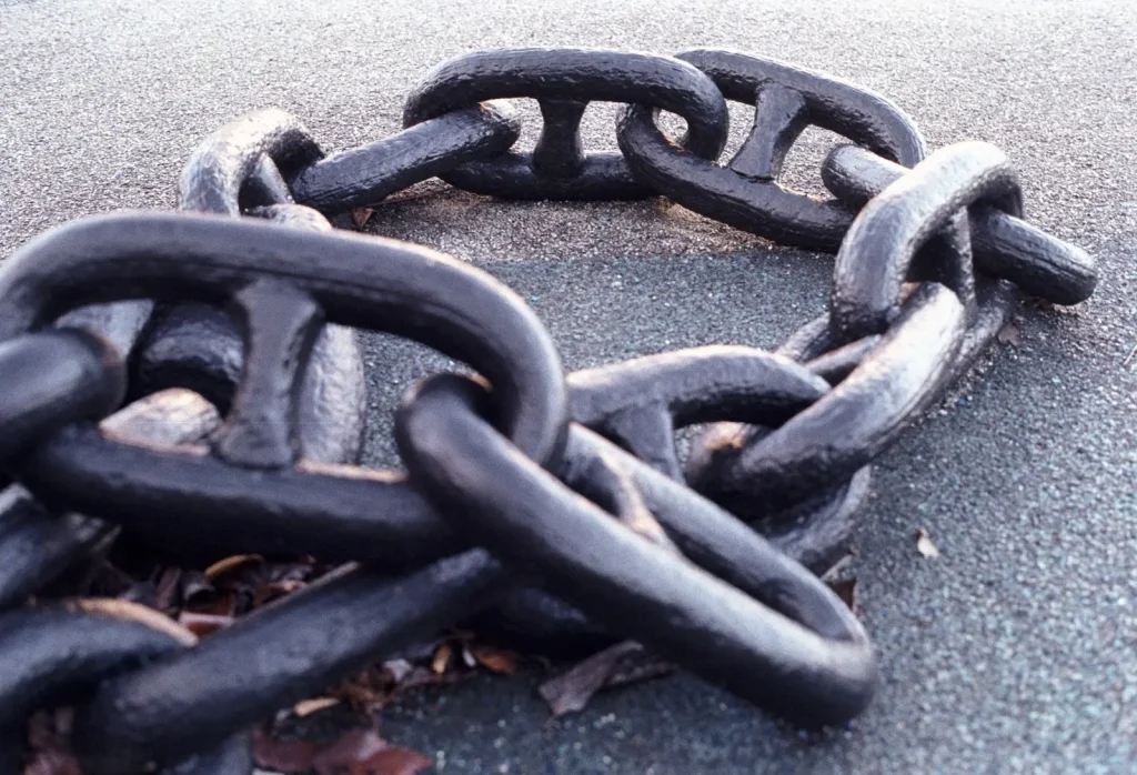close-up photo of black metal chains