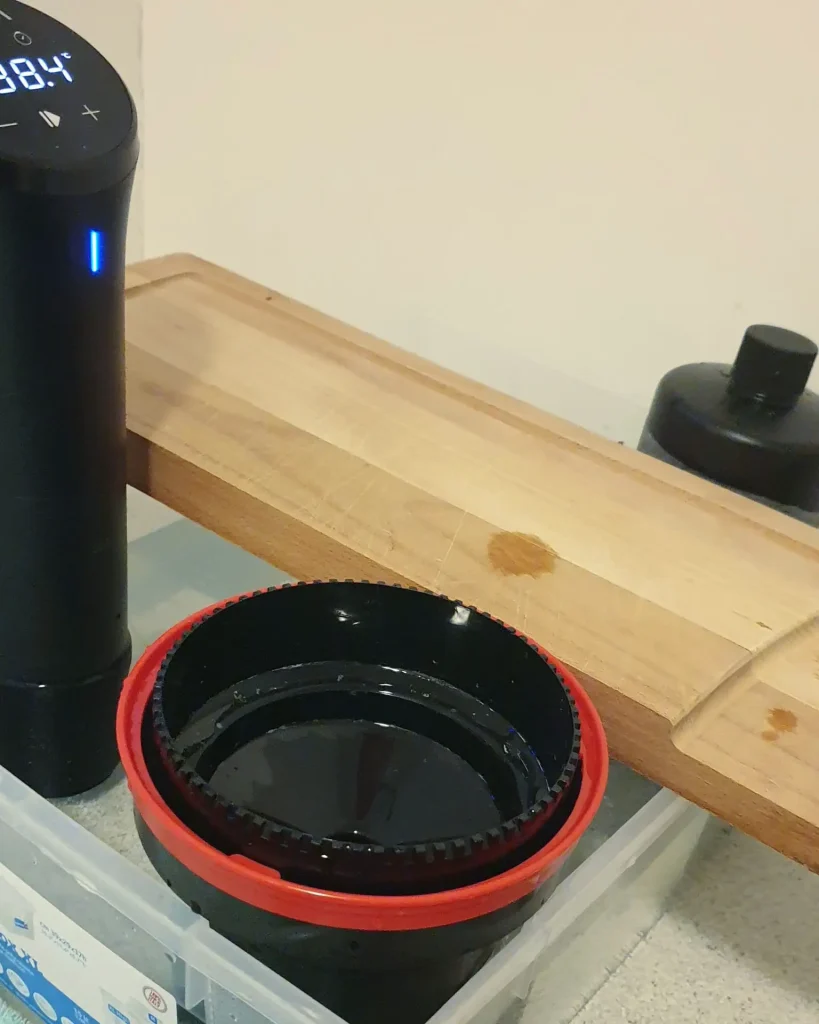 chopping board wedging bottles and tank in water