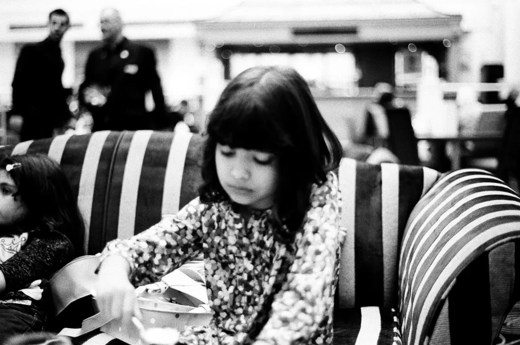 Kid eating chips at restaurant