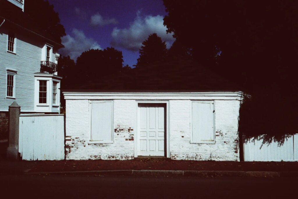 garage in the sun with strong shadows behind