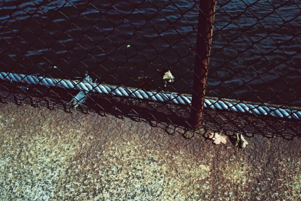 railing next to the ocean boardwalk