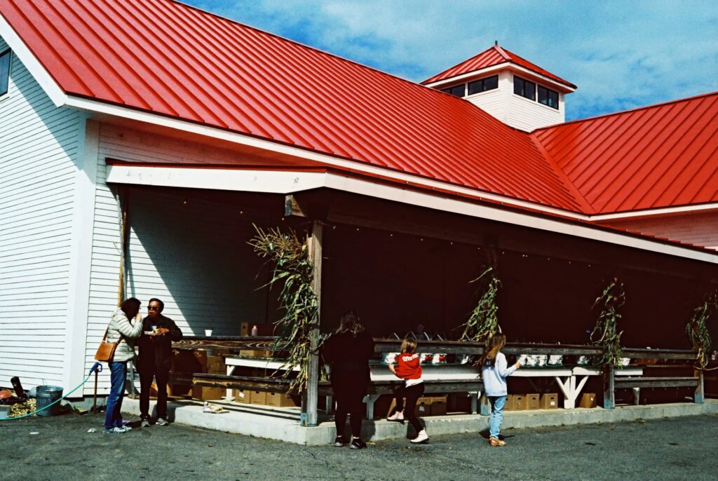 orchard barn with a few people outside