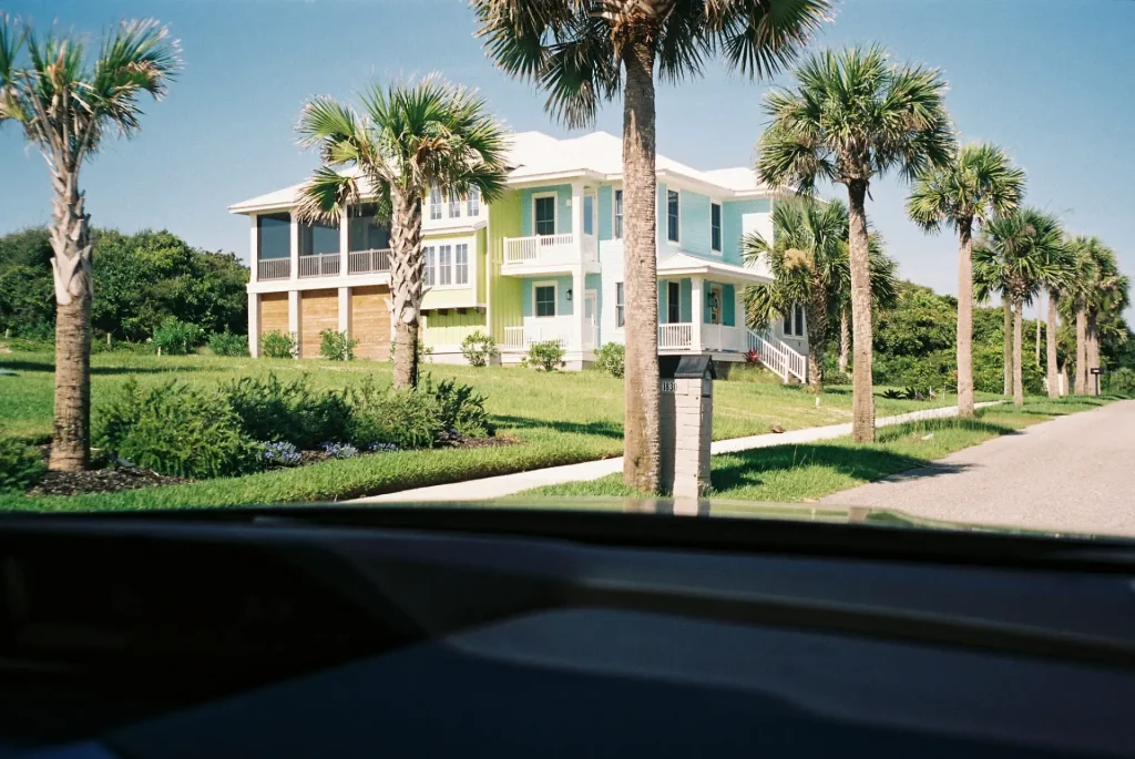 A beach house surrounded by palm trees on Amelia Island